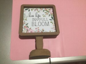 Live Life in Full Bloom wood sign on candlestick stand