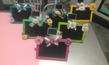 mini chalkboard easels painted in spring colors with flowers and ribbon added