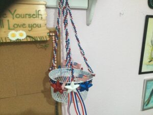 white Americana wire hanging basket