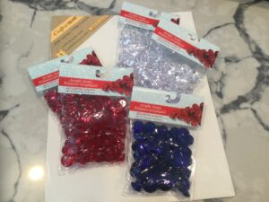 Red, clear and blue acrylic craft gems