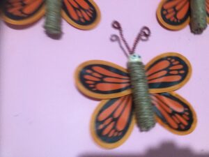 butterfly made with jute body and garden pinwheel butterfly wings